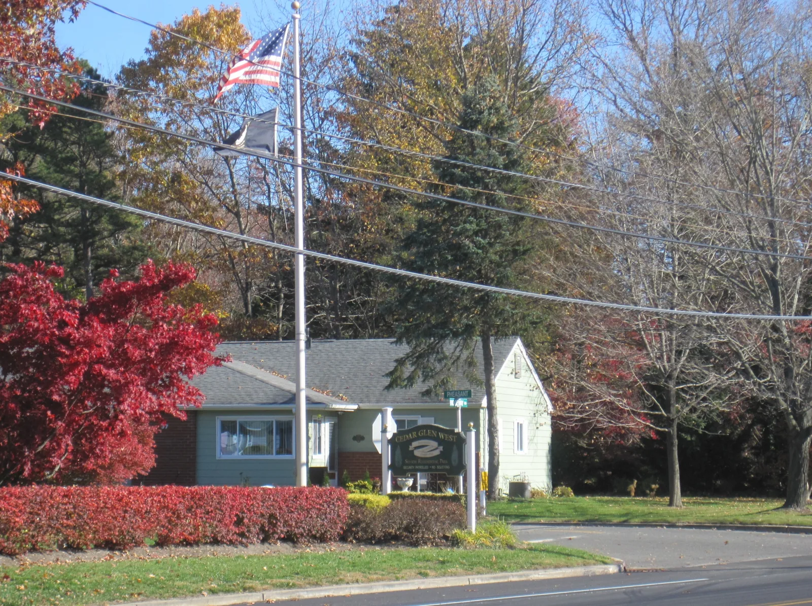 Cedar Glen West sign in front of a community building