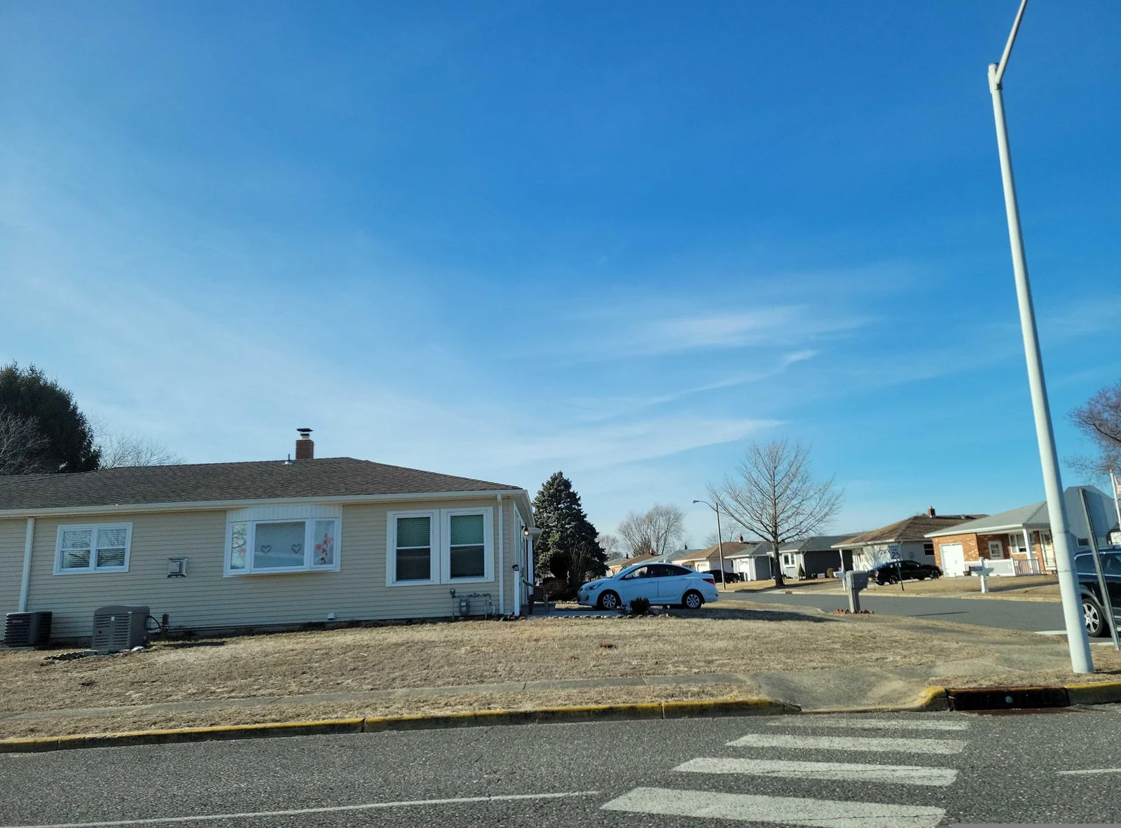 Single-story ranch homes with lawns along Bananier Drive