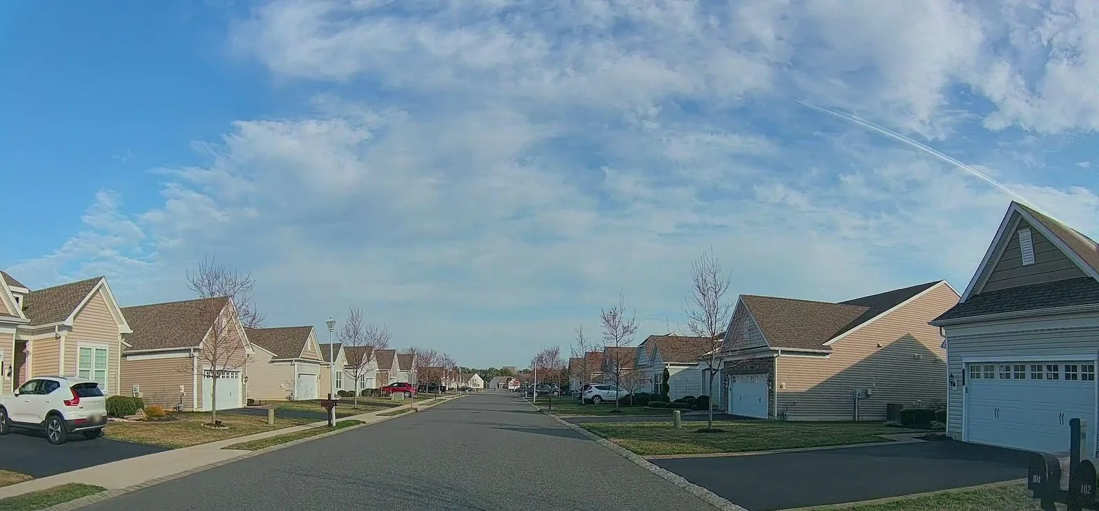 Long street of two-tone homes with garages