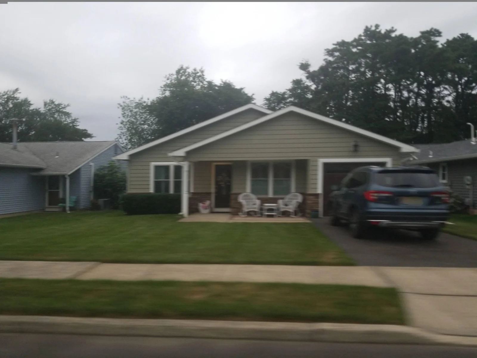 Single-story home with a covered front porch and garage