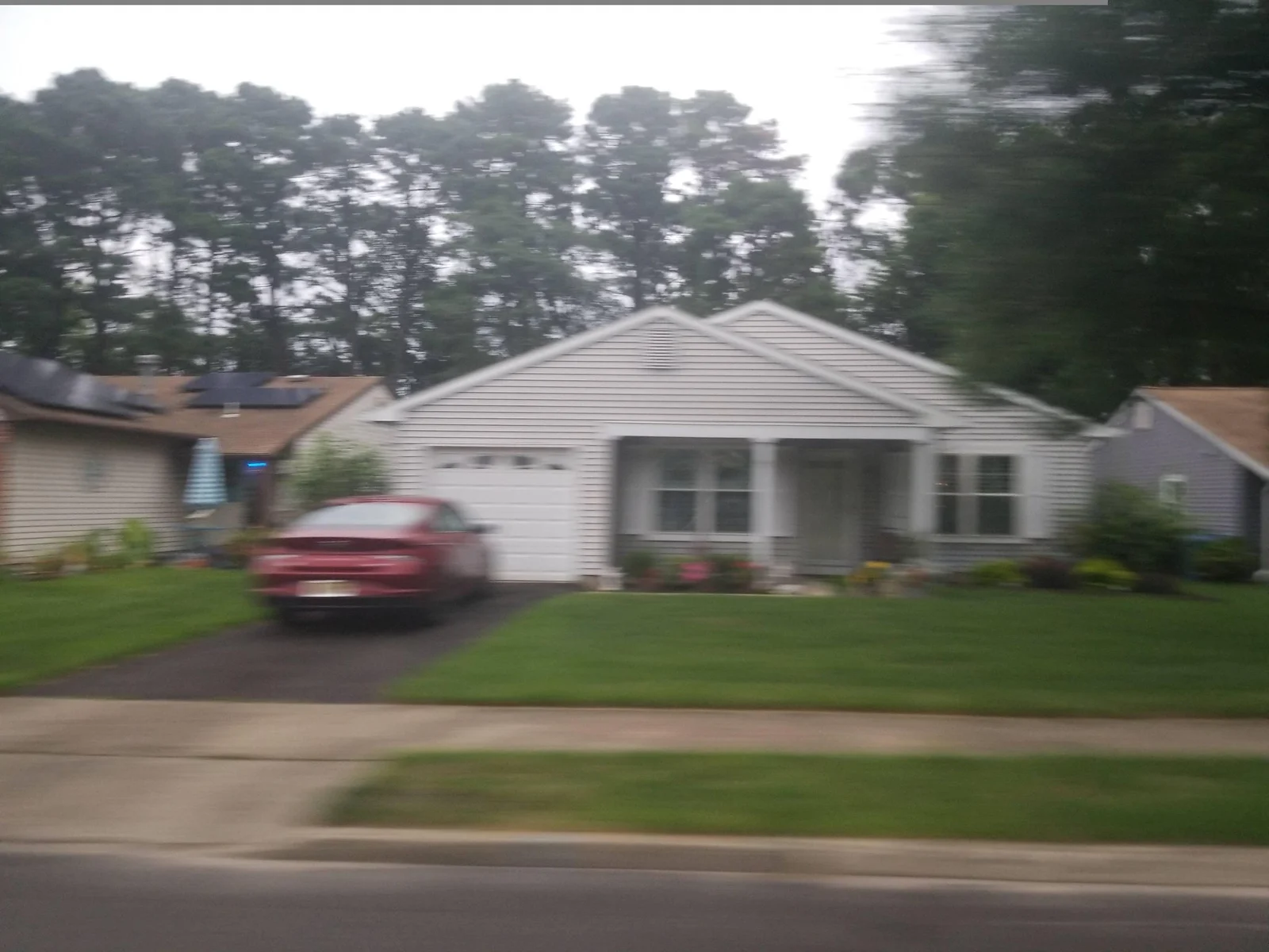 Single-story home with a front-facing garage and lawn