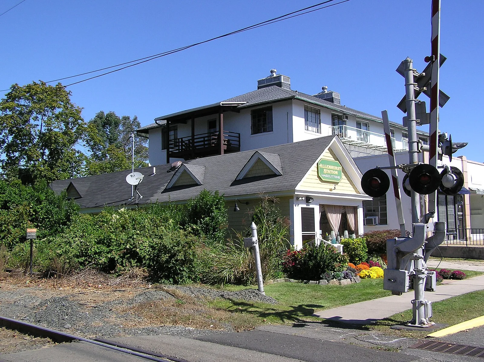 The historic Allenhurst station building on Spier Avenue beside the railroad crossing