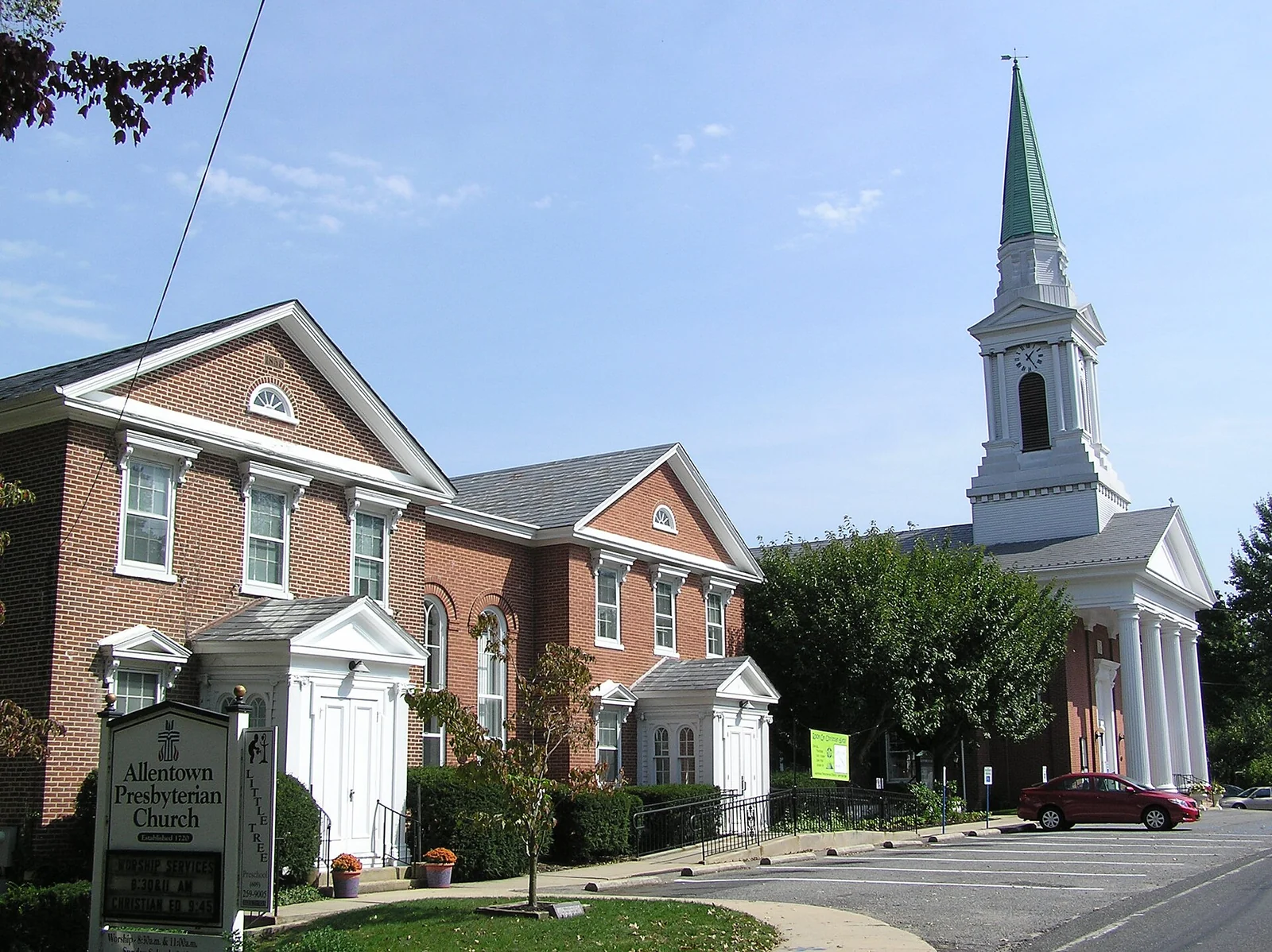 Allentown Presbyterian Church on High Street, a white steeple rising beside red brick buildings
