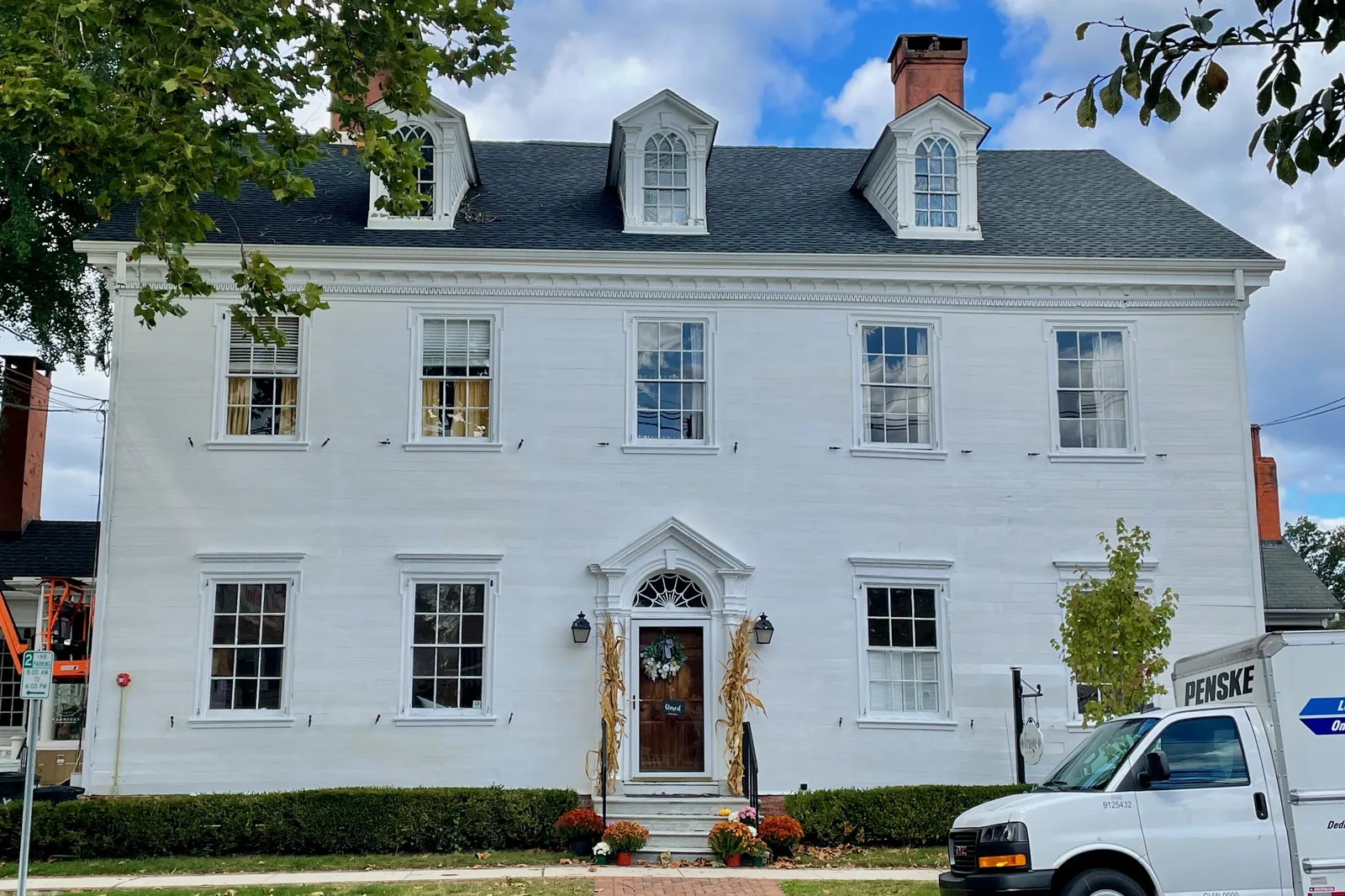 The white, Georgian-style John Imlay House on South Main Street, with dormers and a fanlight over the door