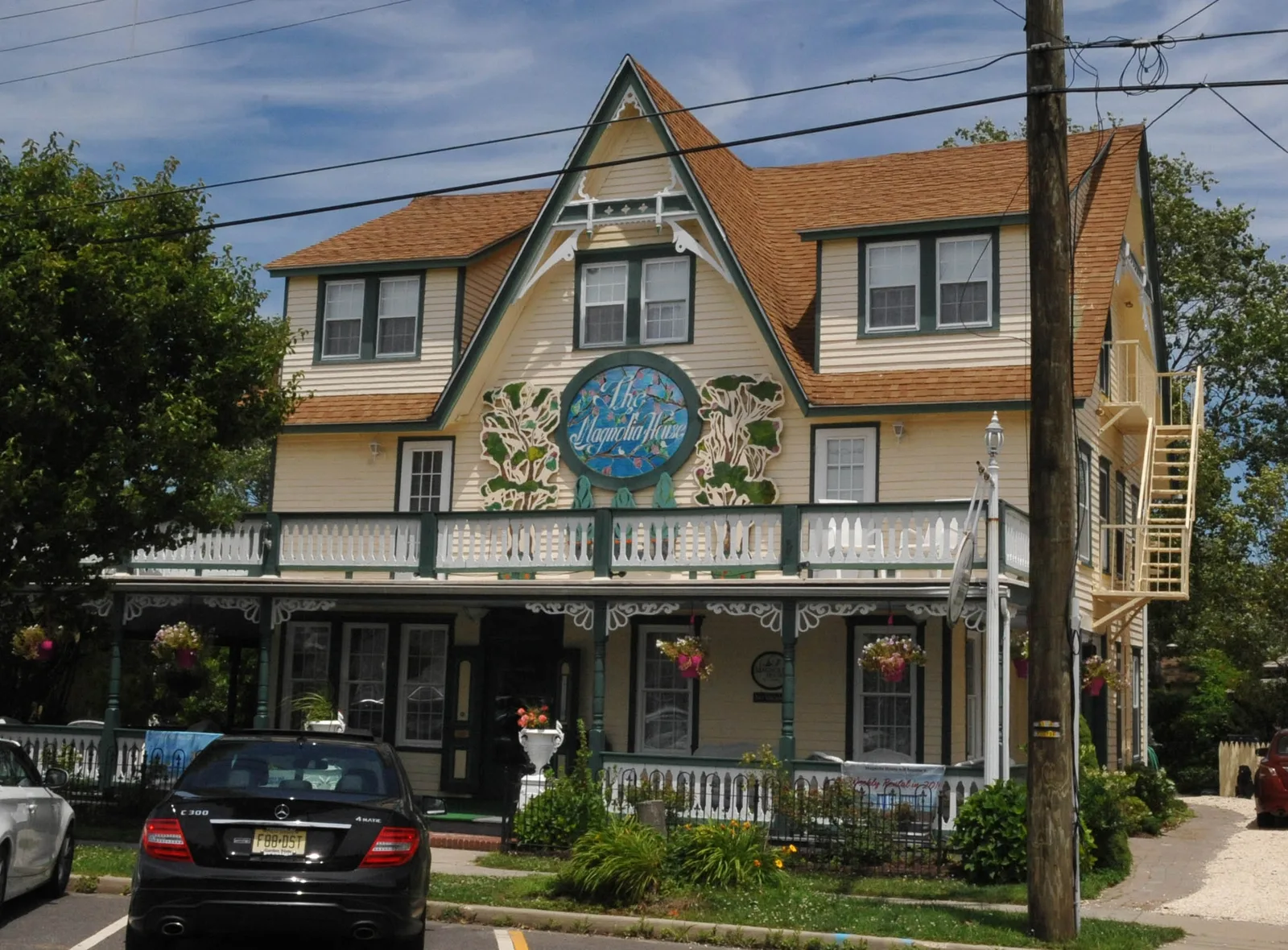 The Magnolia House, a Queen Anne style former boarding house with a wraparound porch, in the Beach Haven Historic District