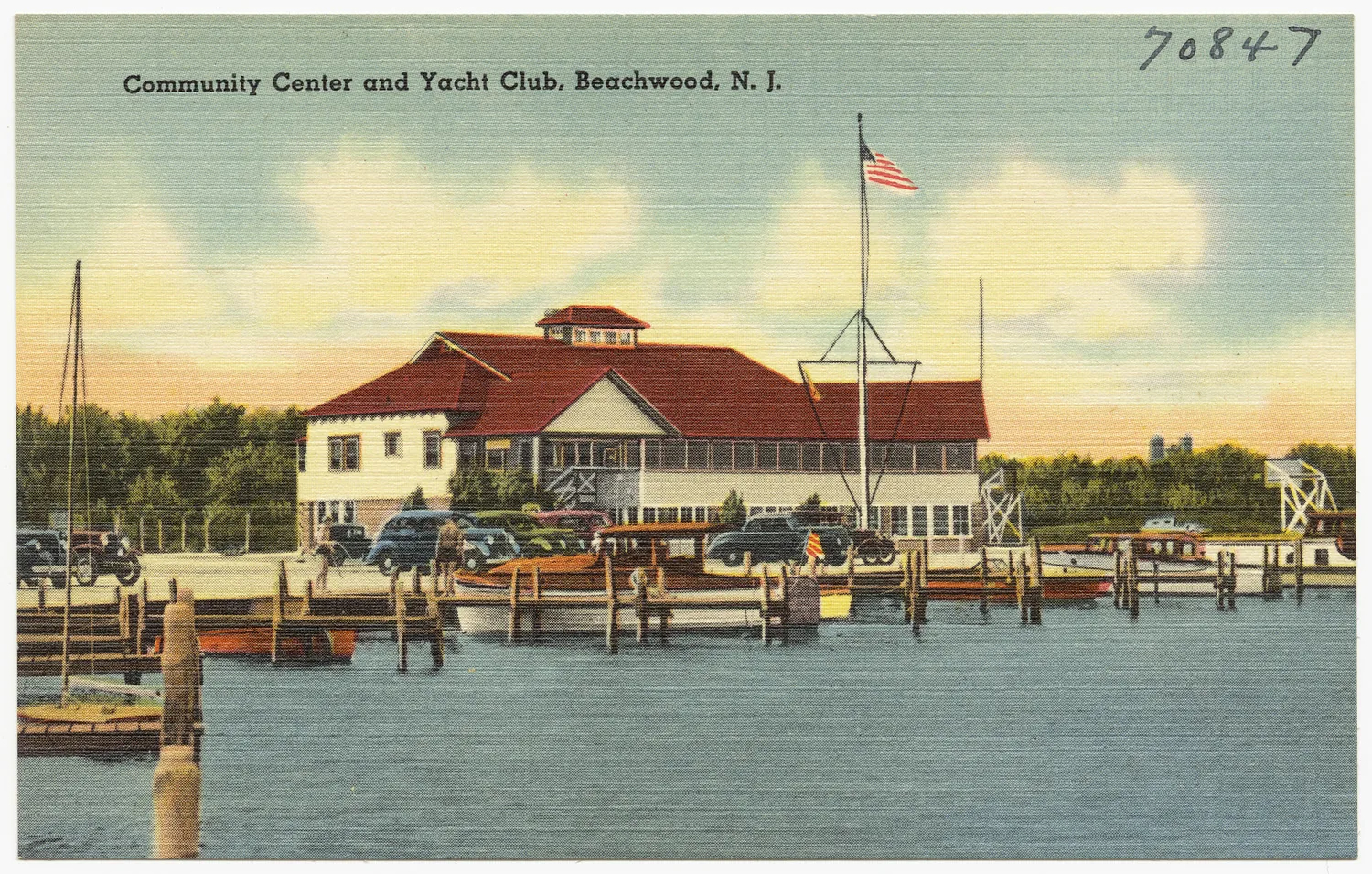 Vintage postcard of the Beachwood community center and yacht club, a red-roofed clubhouse with boats at the docks