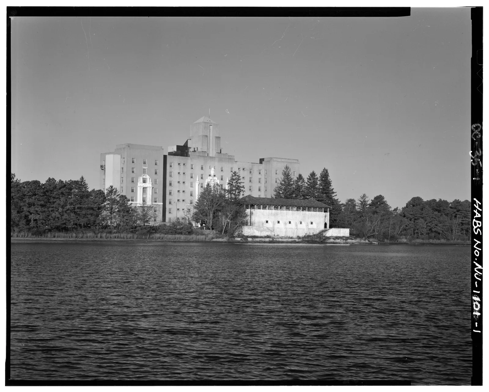 Black and white photo of the former Royal Pines Hotel in Pinewald seen across Crystal Lake