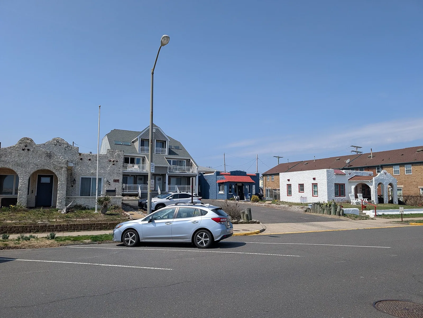 Mission Revival style houses with arched stucco fronts on Ocean Avenue in Bradley Beach