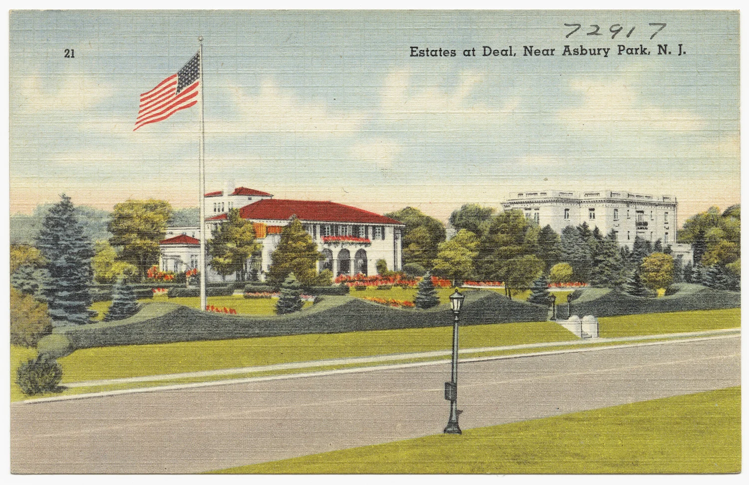Vintage linen postcard of large houses with red tile roofs, lawns and a flagpole along a road in Deal