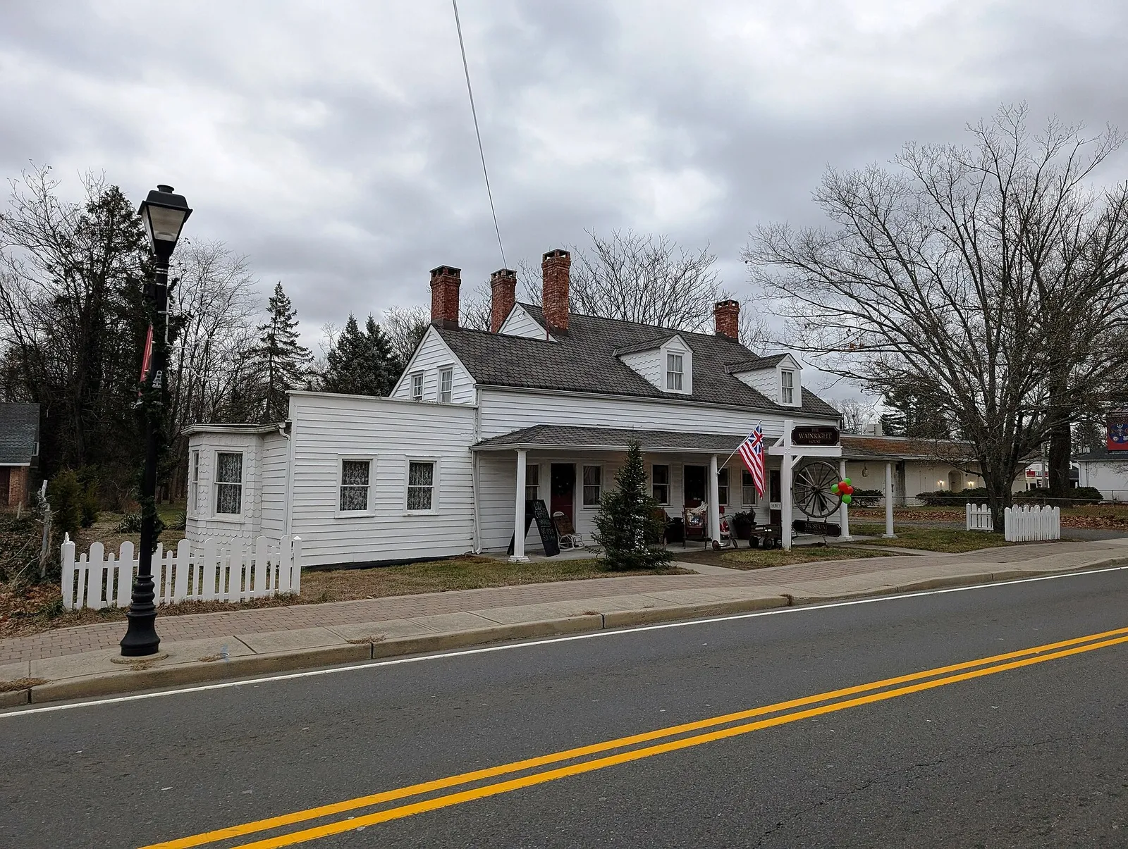 The white clapboard Wainwright House, now a museum, with a lamp post in front