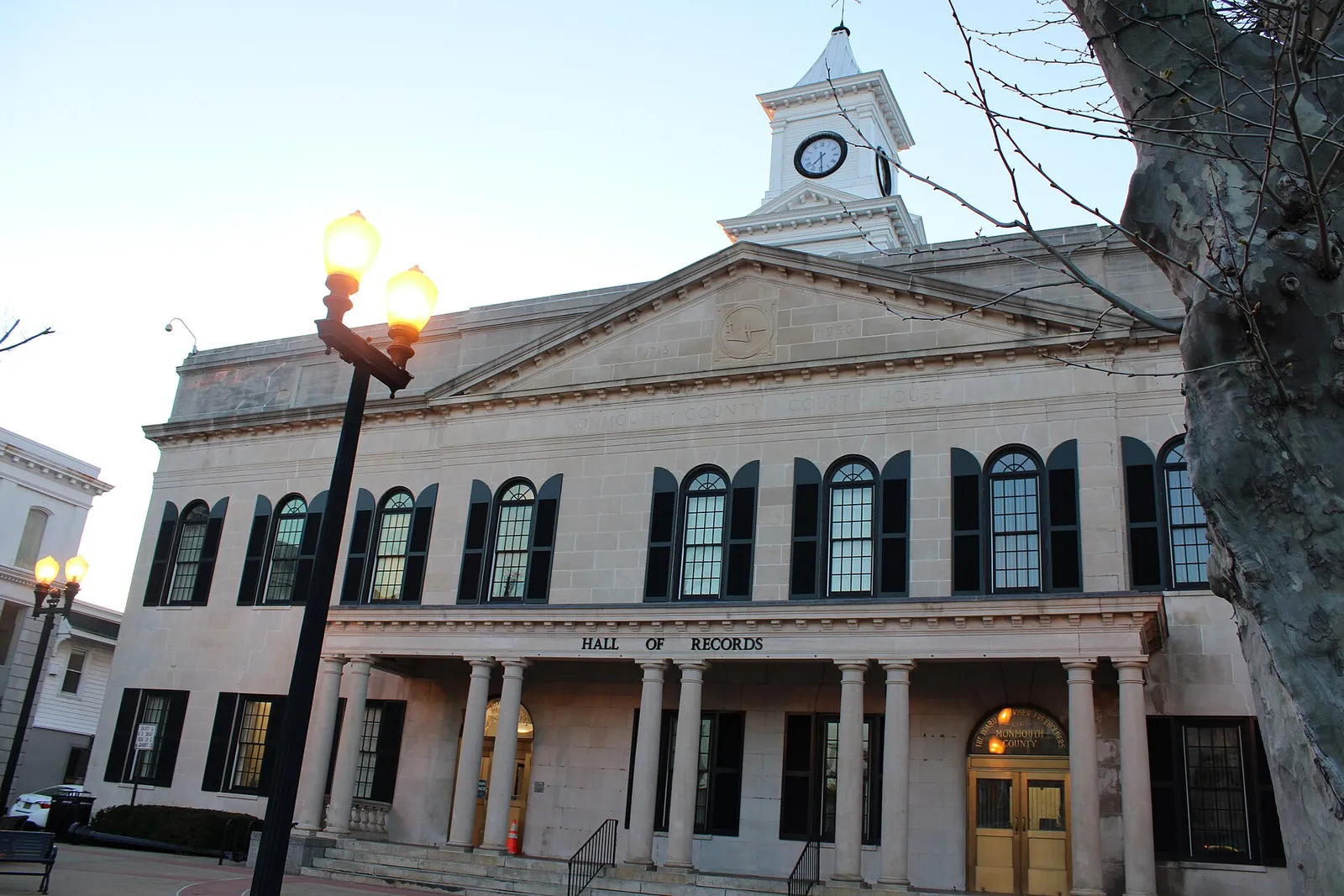 Neoclassical Hall of Records with columns, arched windows and a clock cupola