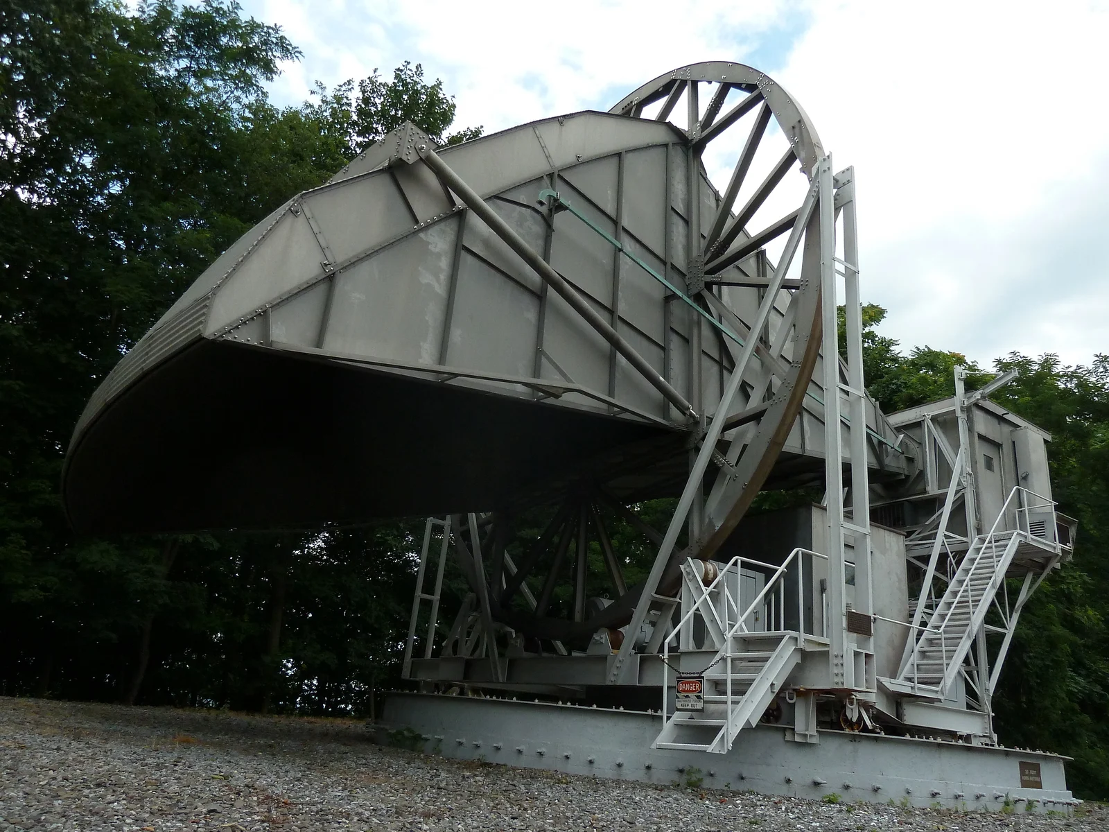 The large white Horn Antenna on Crawford Hill, a horn-shaped radio antenna on a steel turntable among trees