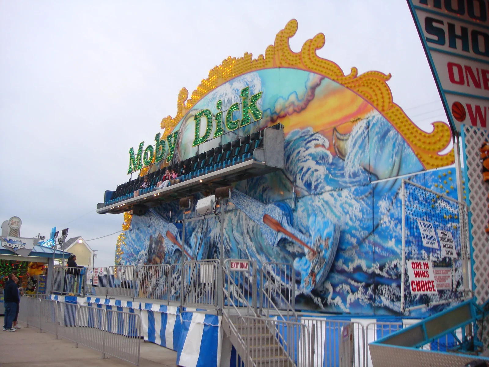 The Moby Dick ride with its painted ocean-wave facade and ornate gold crest at Keansburg Amusement Park