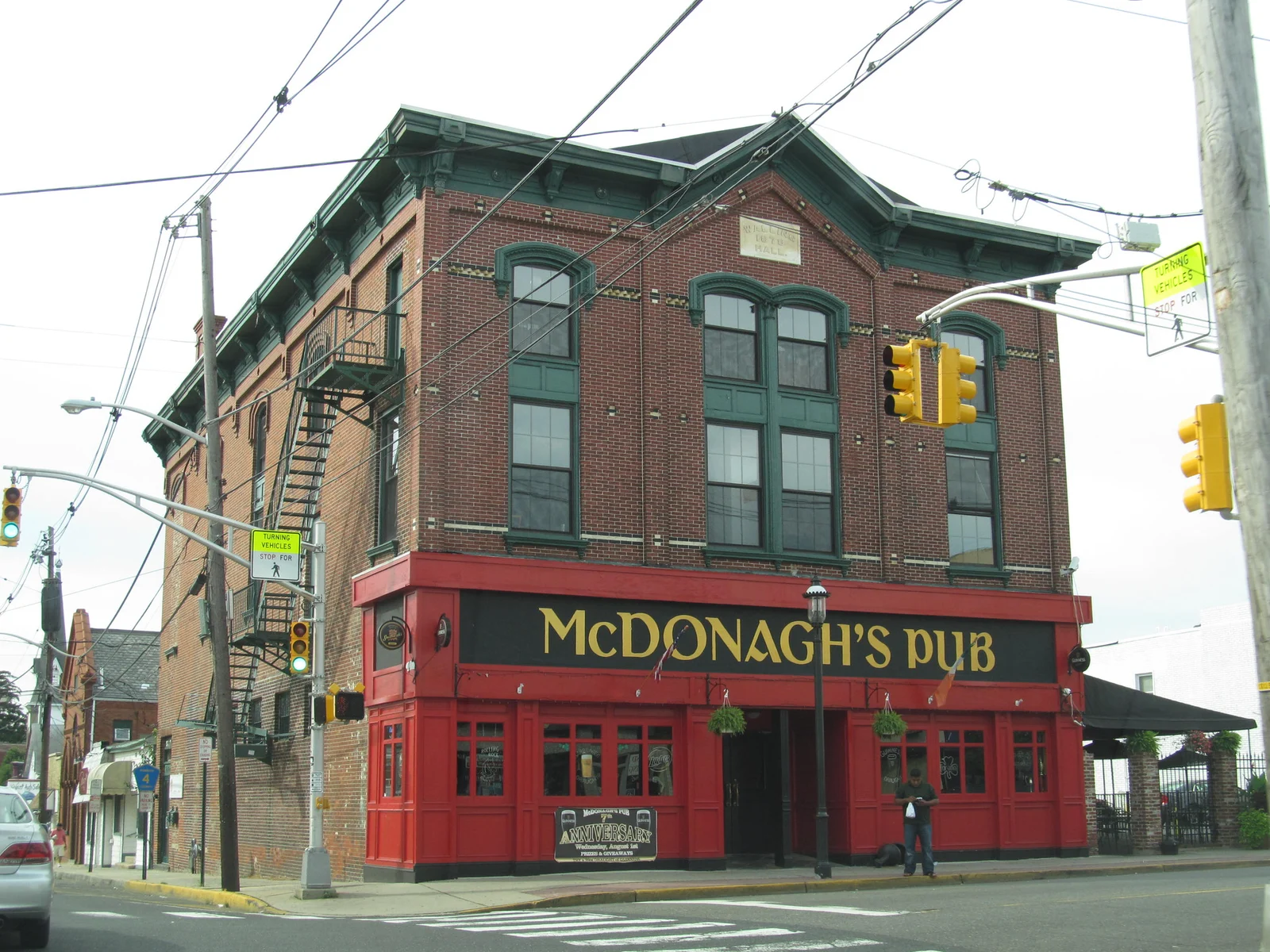 The red-trimmed brick McDonagh's Pub building on a downtown Keyport corner