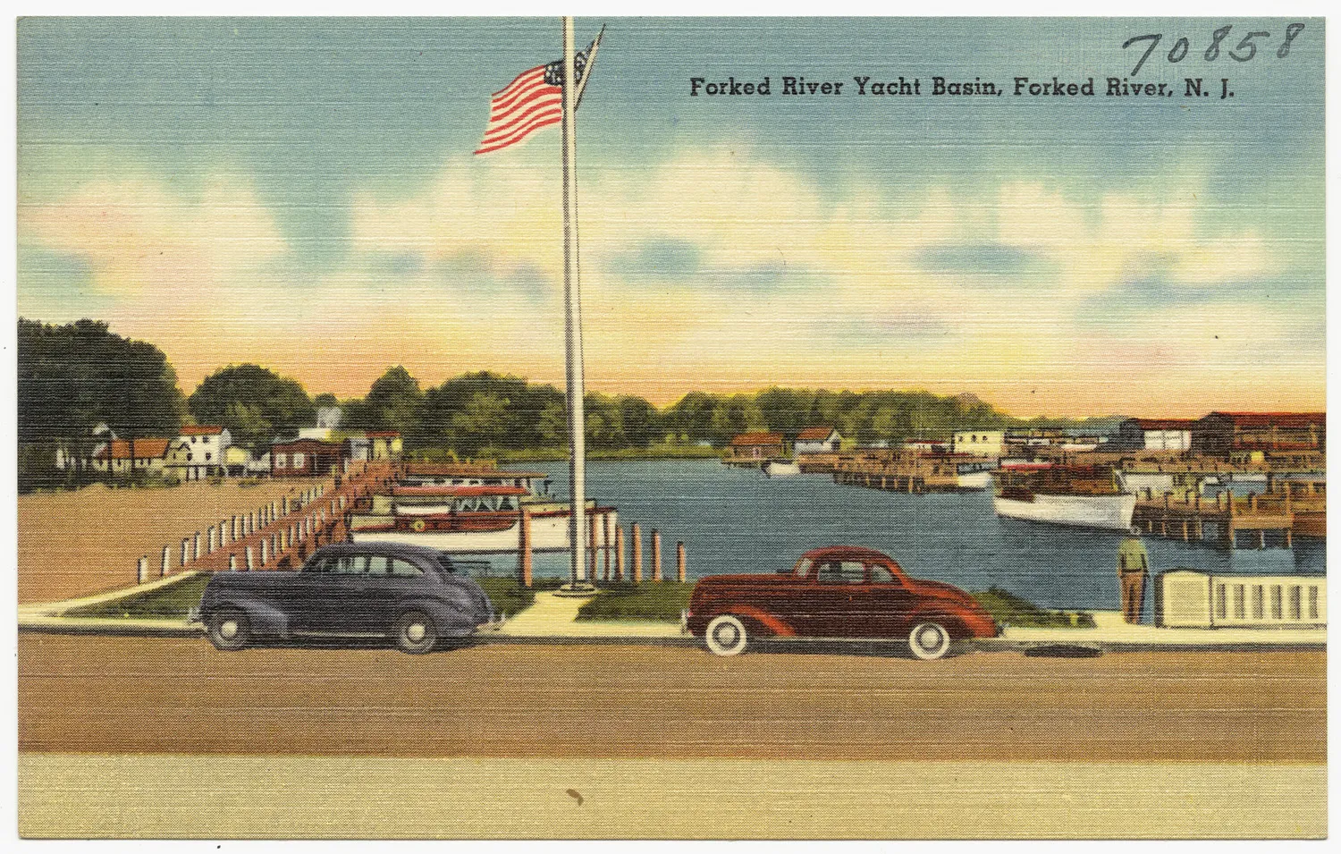 Vintage color postcard of boats at the Forked River Yacht Basin with a flagpole and two old cars