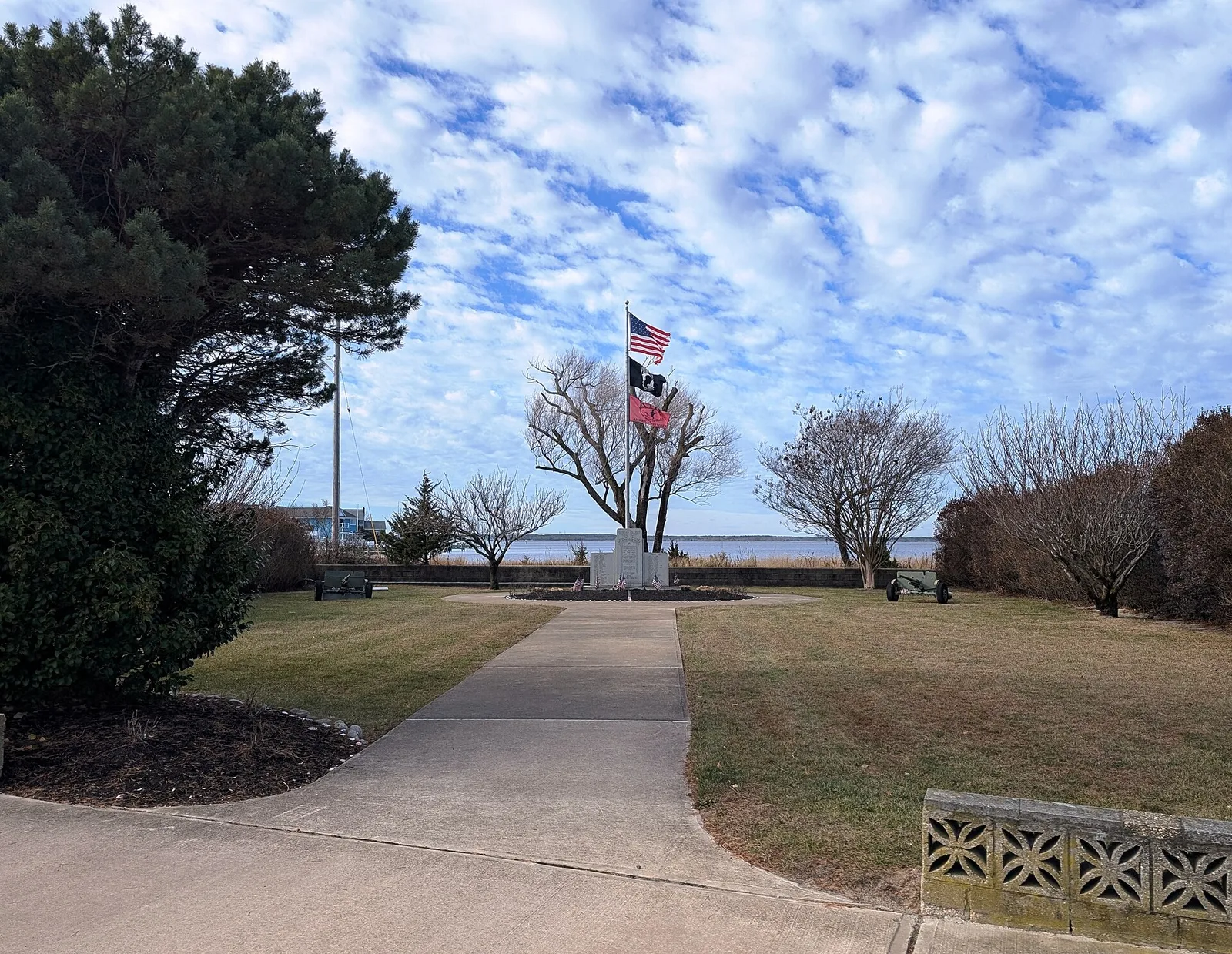Walkway to the flags at the veterans memorial on Lavallette's bay front, with Barnegat Bay beyond