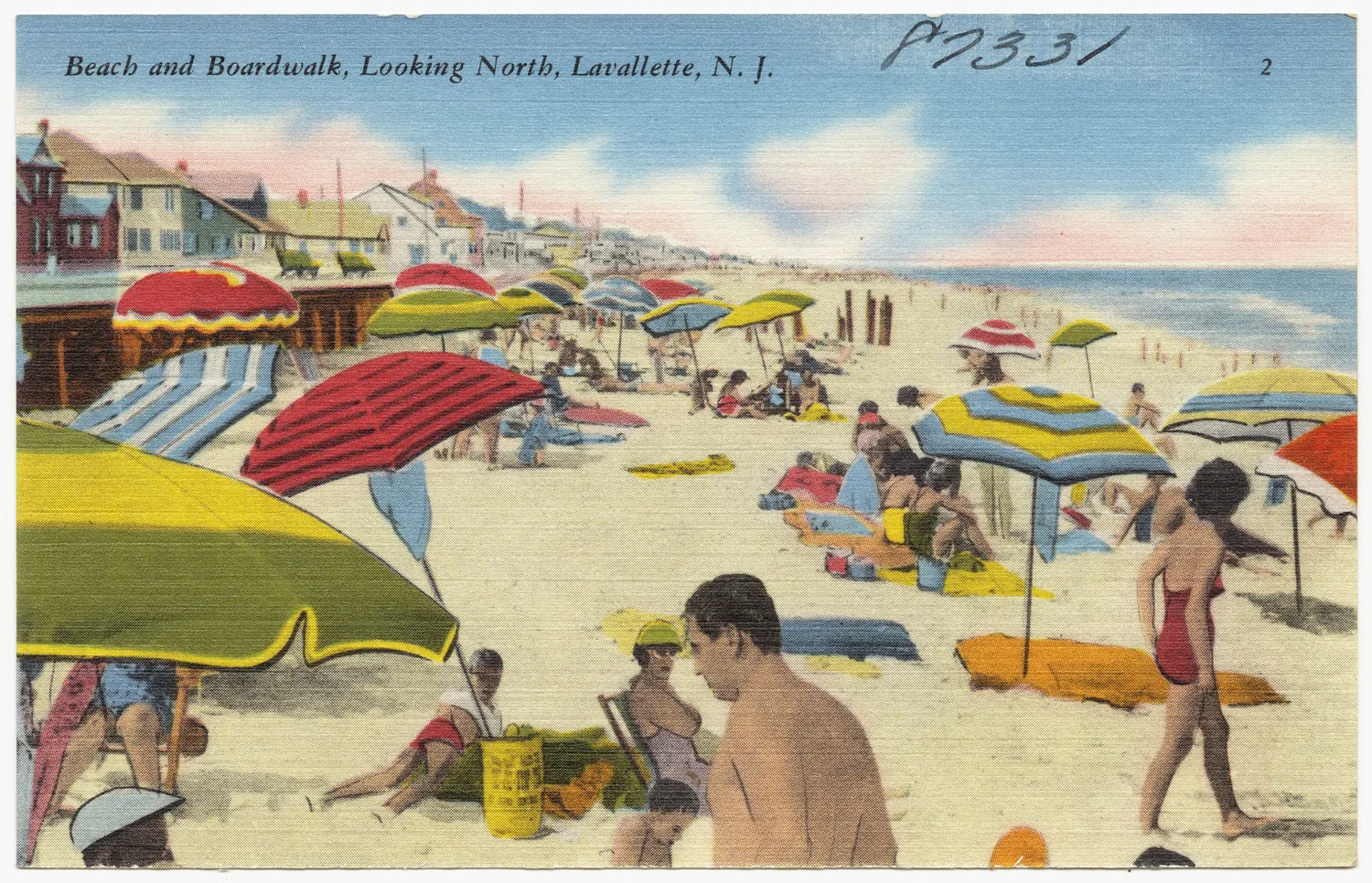 Vintage linen postcard of a crowded Lavallette beach with striped umbrellas and the boardwalk, looking north