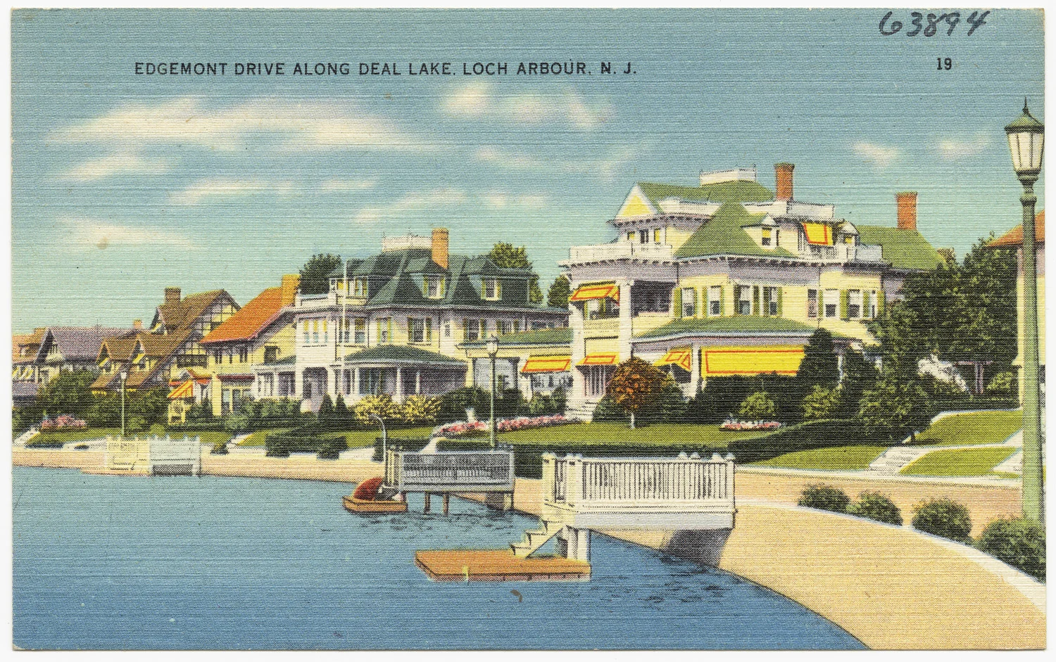 Vintage linen postcard of large Victorian and shingle-style homes with striped awnings along Edgemont Drive, with small docks on Deal Lake in front