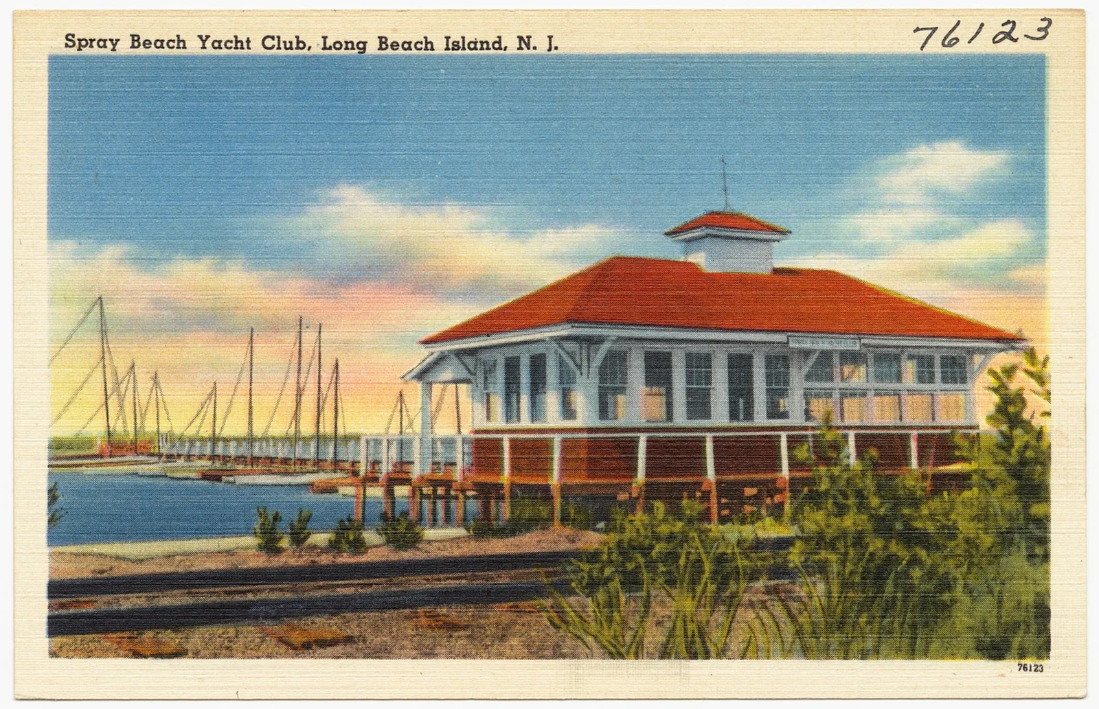Vintage linen postcard of the red-roofed Spray Beach Yacht Club clubhouse with a cupola, beside sailboat masts on the bay