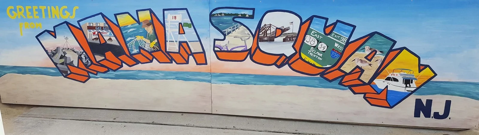Postcard-style mural with big block letters spelling Manasquan filled with shore scenes above a painted beach