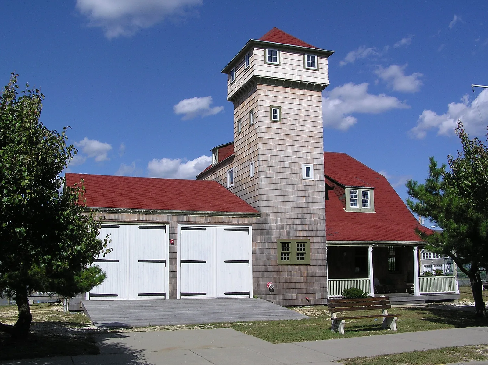 The shingled Squan Beach Life-Saving Station with its red roof and lookout tower on Ocean Avenue