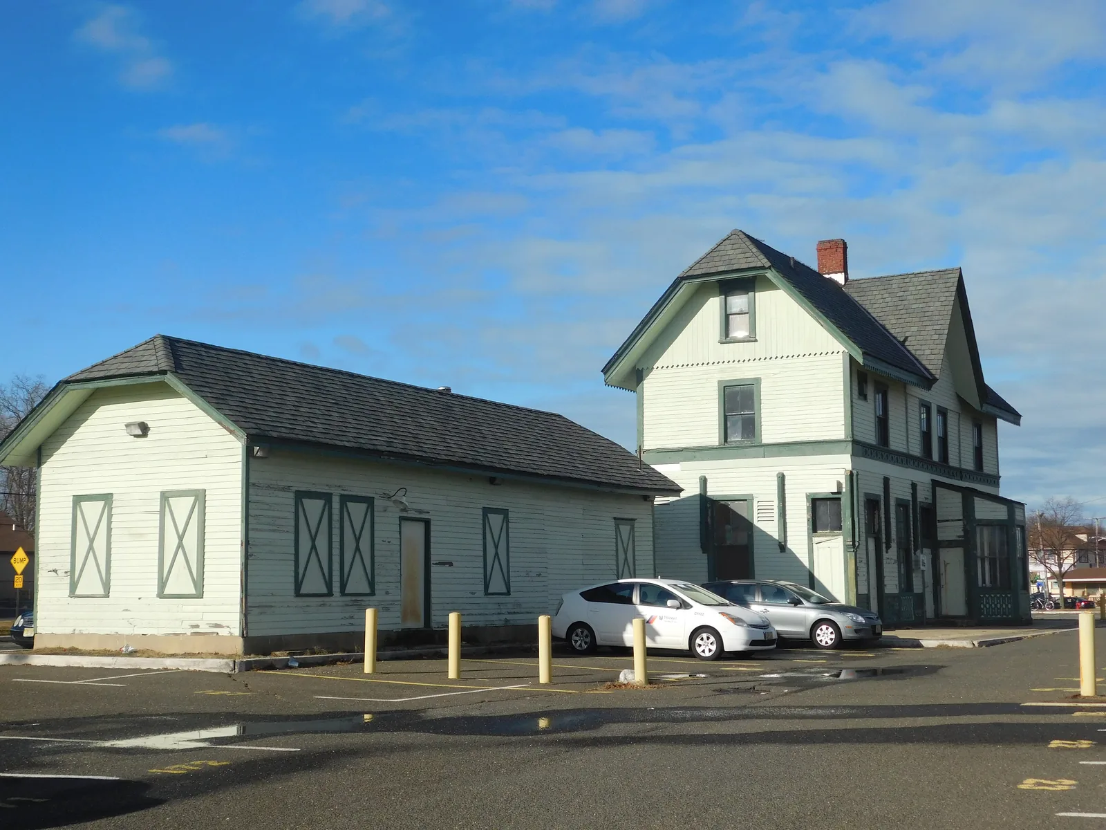 The former Central Railroad of New Jersey depot at Matawan, a two-story Victorian station and a long freight house painted pale green with dark trim