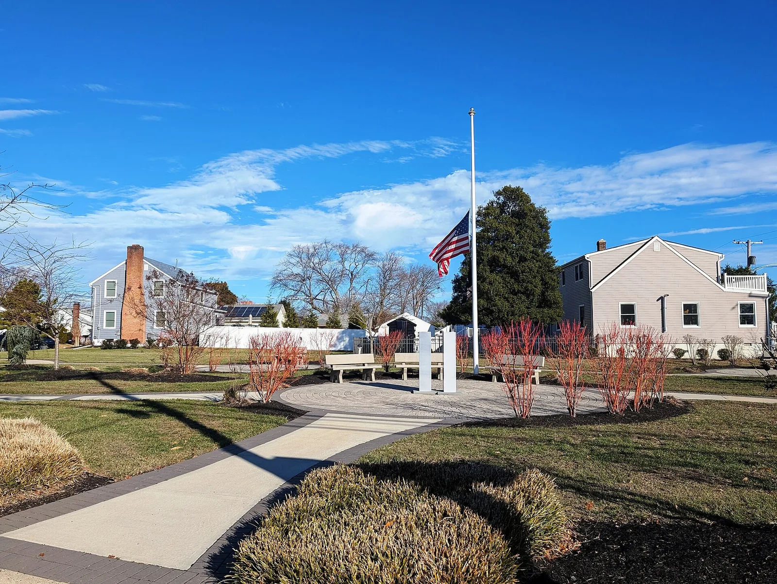 The September 11 memorial garden with a flagpole and walkway on West Sylvania Avenue