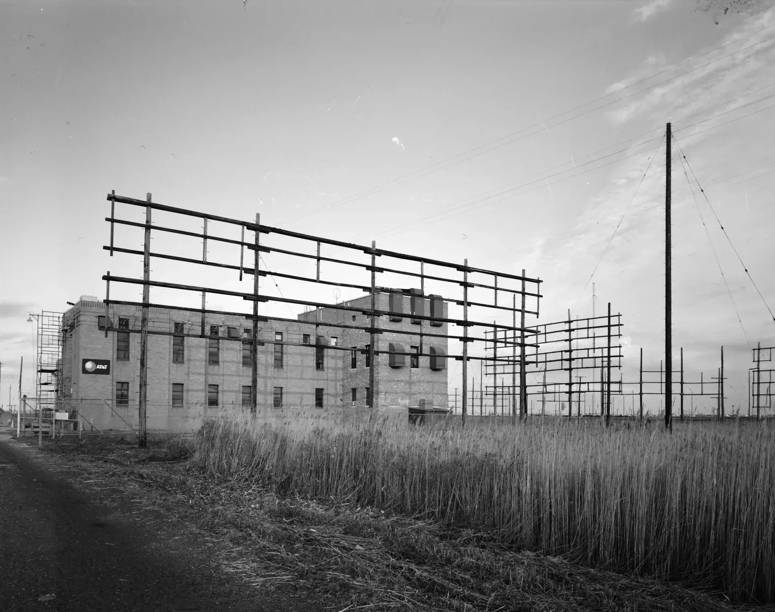 Black and white survey photograph of the former AT&T radio station building and its antenna frames in Ocean Gate