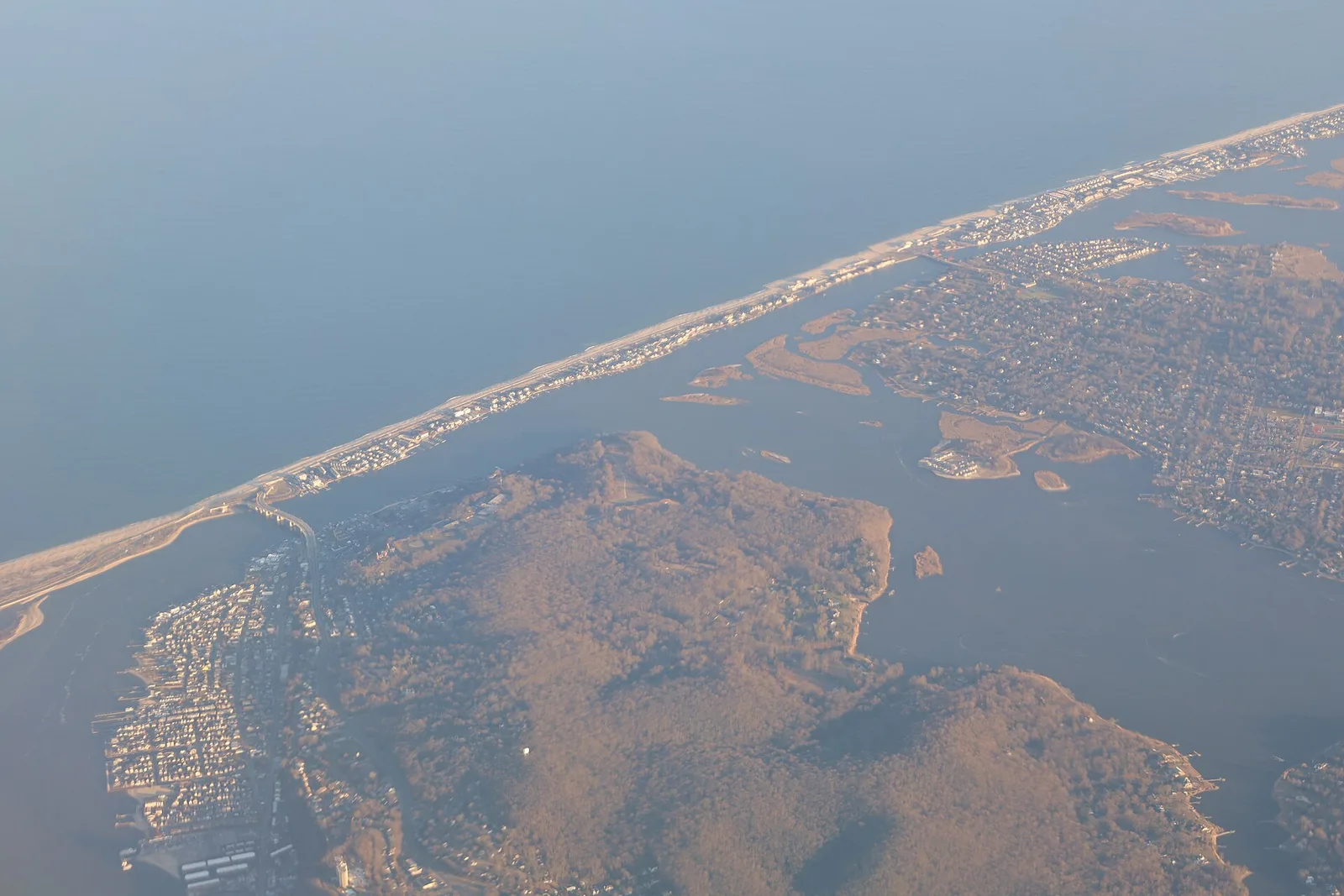 Aerial view of the narrow Sea Bright peninsula with the ocean on one side and the river marshes on the other