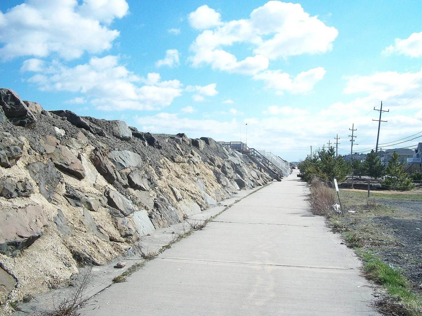 A path running beside the tall rock seawall that protects Sea Bright from the ocean