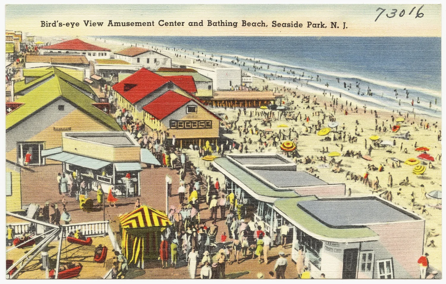 Vintage postcard bird's-eye view of the Seaside Park amusement center, crowded boardwalk and busy bathing beach