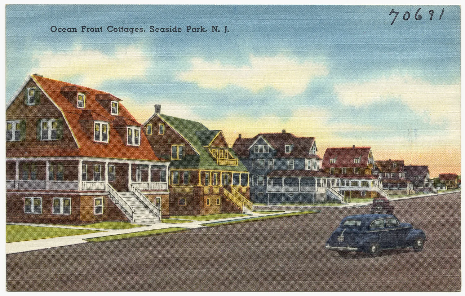 Vintage postcard of large shingled oceanfront cottages with wide porches along a Seaside Park street