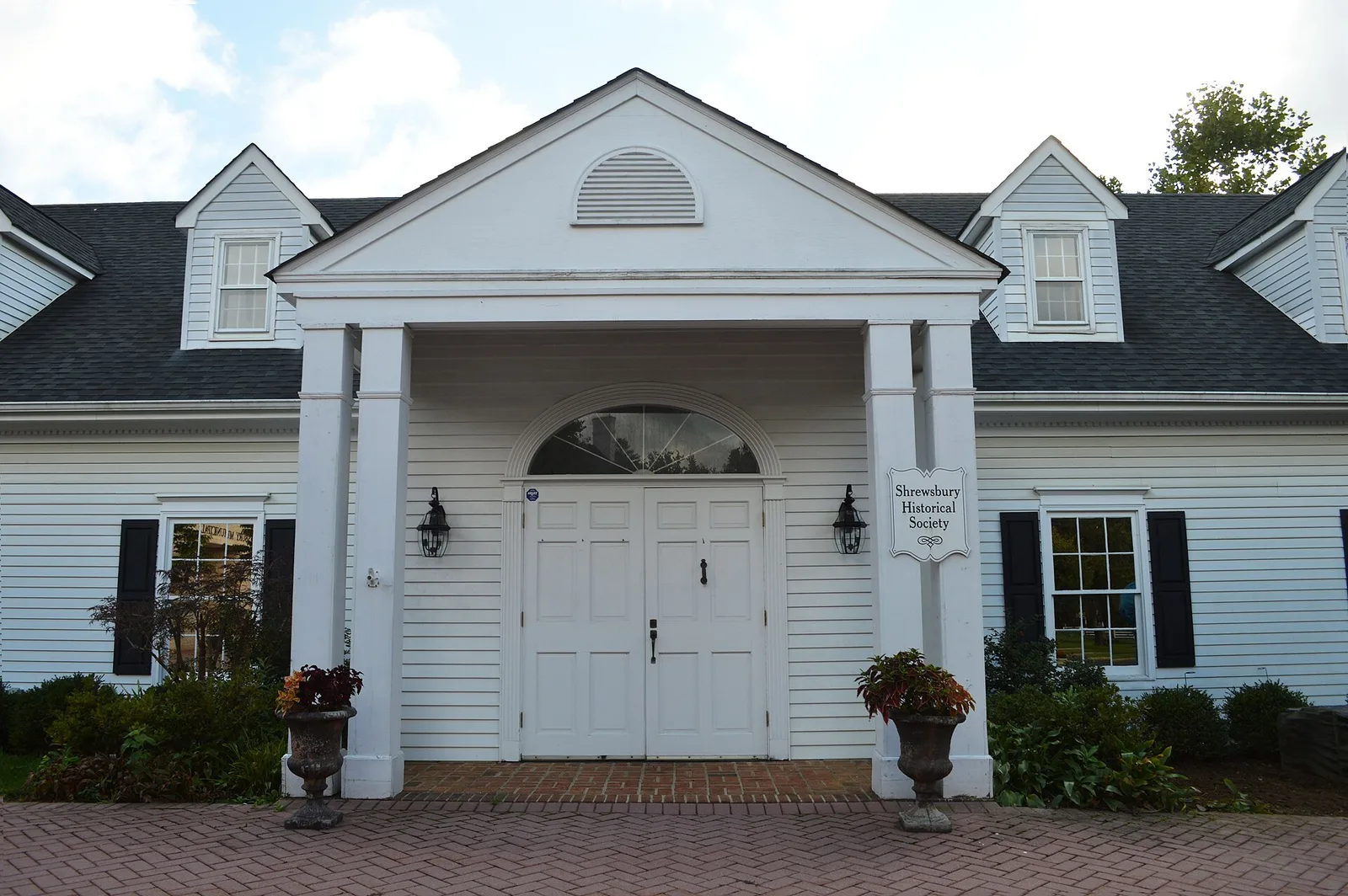 The white columned entrance of the Shrewsbury Historical Society building