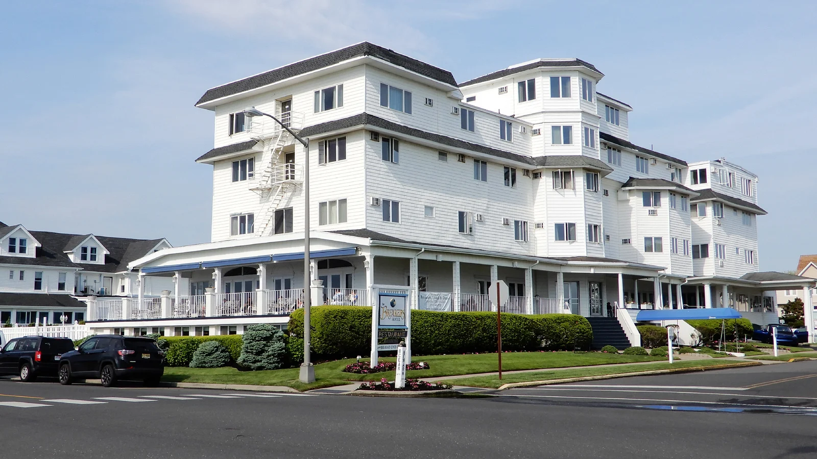 The large white Breakers hotel with a long front porch, across the street from the ocean