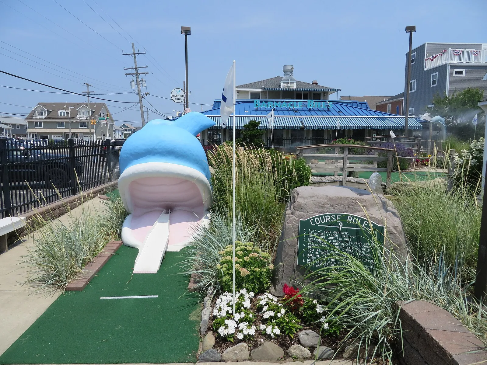 Miniature golf course with a big blue whale and a putting green at Barnacle Bill's in Ortley Beach