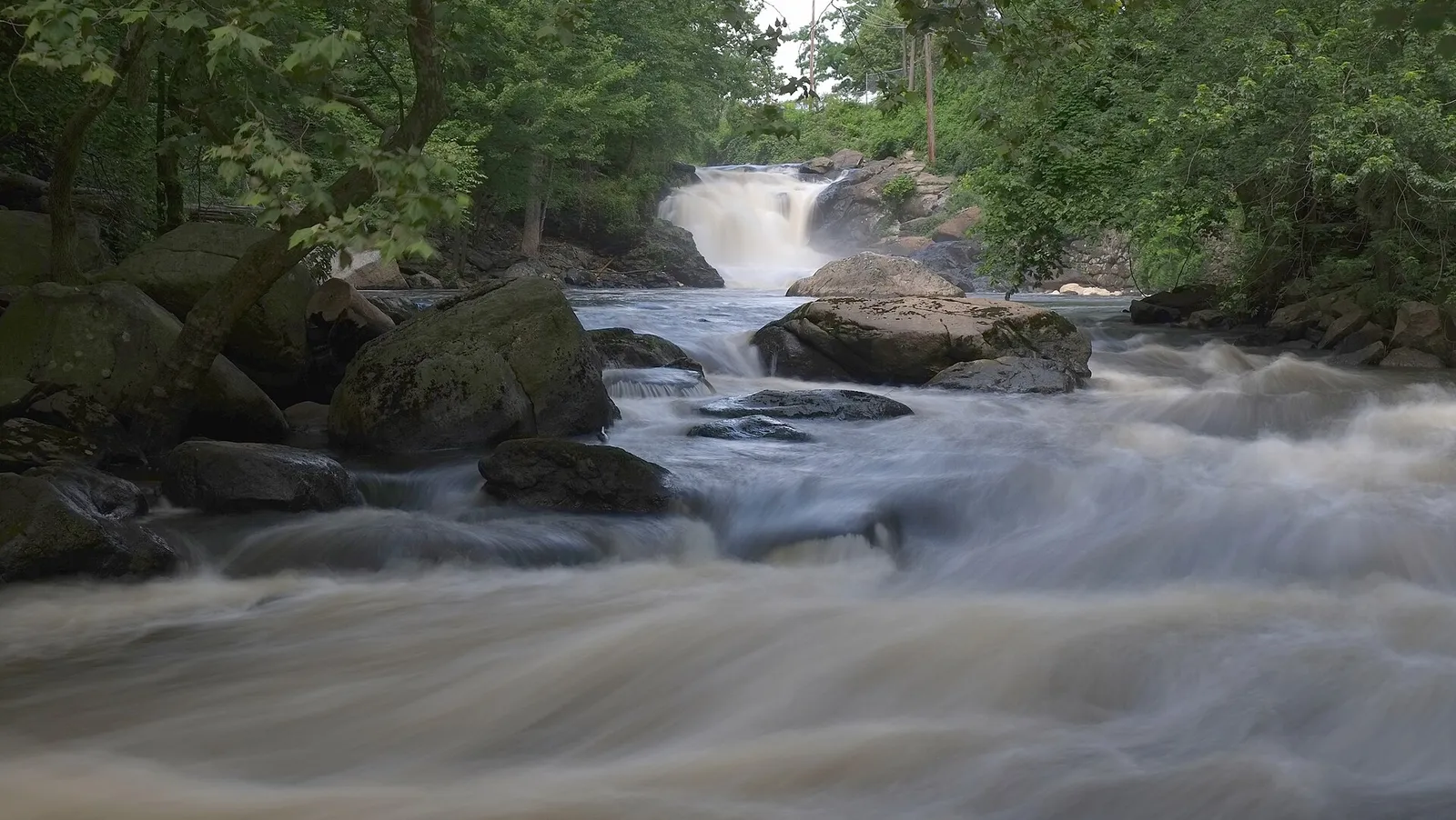 The Rockaway River rushing over rocks below Boonton Falls