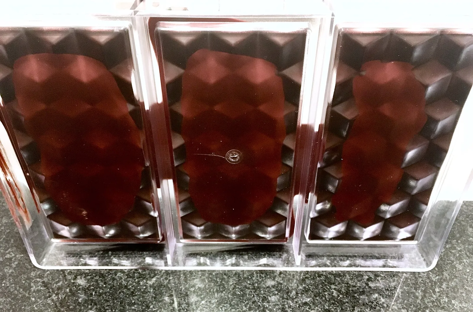 Tempered chocolate setting in clear polycarbonate bar molds