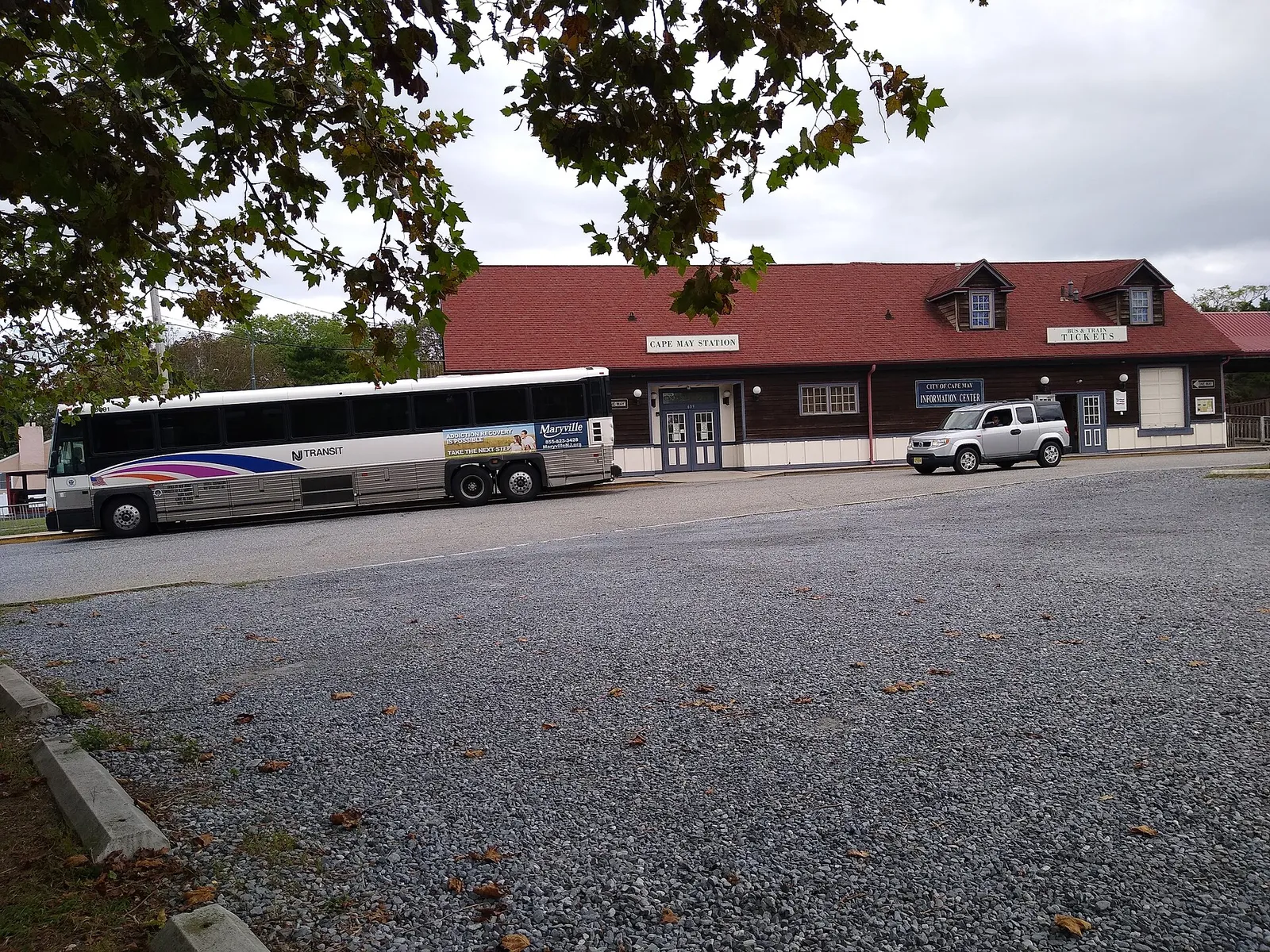 The Cape May Station and Welcome Center building beside a parking lot