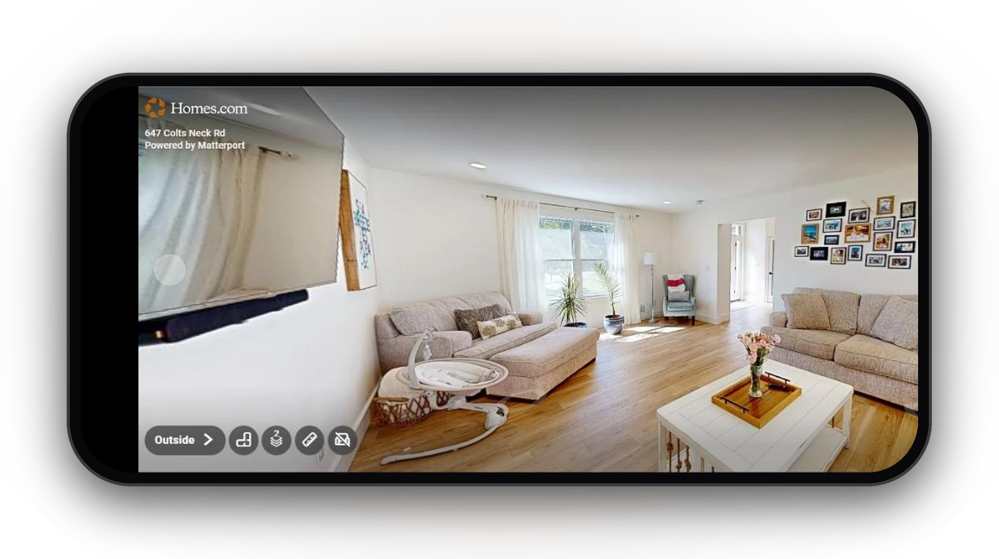 The Matterport 3D tour of the living room at 647 Colts Neck Rd on Homes.com, on a phone held sideways